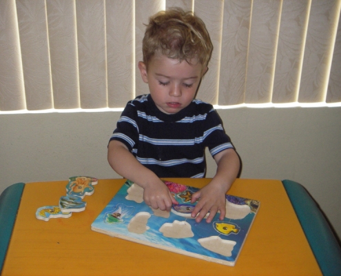 Puzzle time at Giggle And Grins Daycare